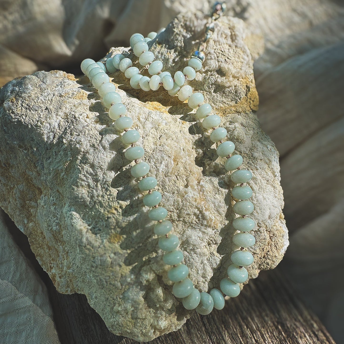 Pale green, graduated sized Amazonite beaded necklace, hand knotted on a beige sild thread. Natural Earth Collective Ohio
