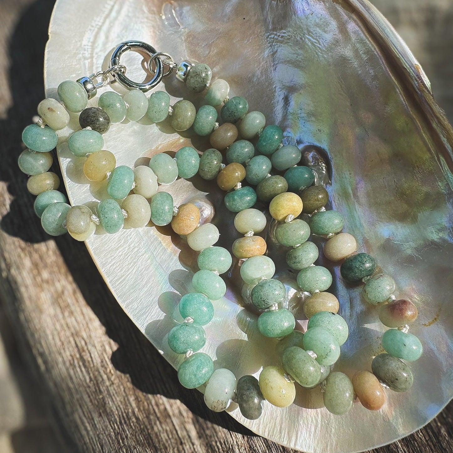 Multi shade Amazonite Beaded Necklace, hand knotted on cream silk thread with a circle push clasp that can be worn in back or front to accommodate a pendant. Natural Earth Collective, Ohio
