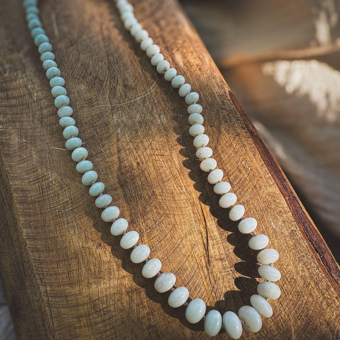 Pale green, graduated sized Amazonite beaded necklace, hand knotted on a beige sild thread. Natural Earth Collective Ohio