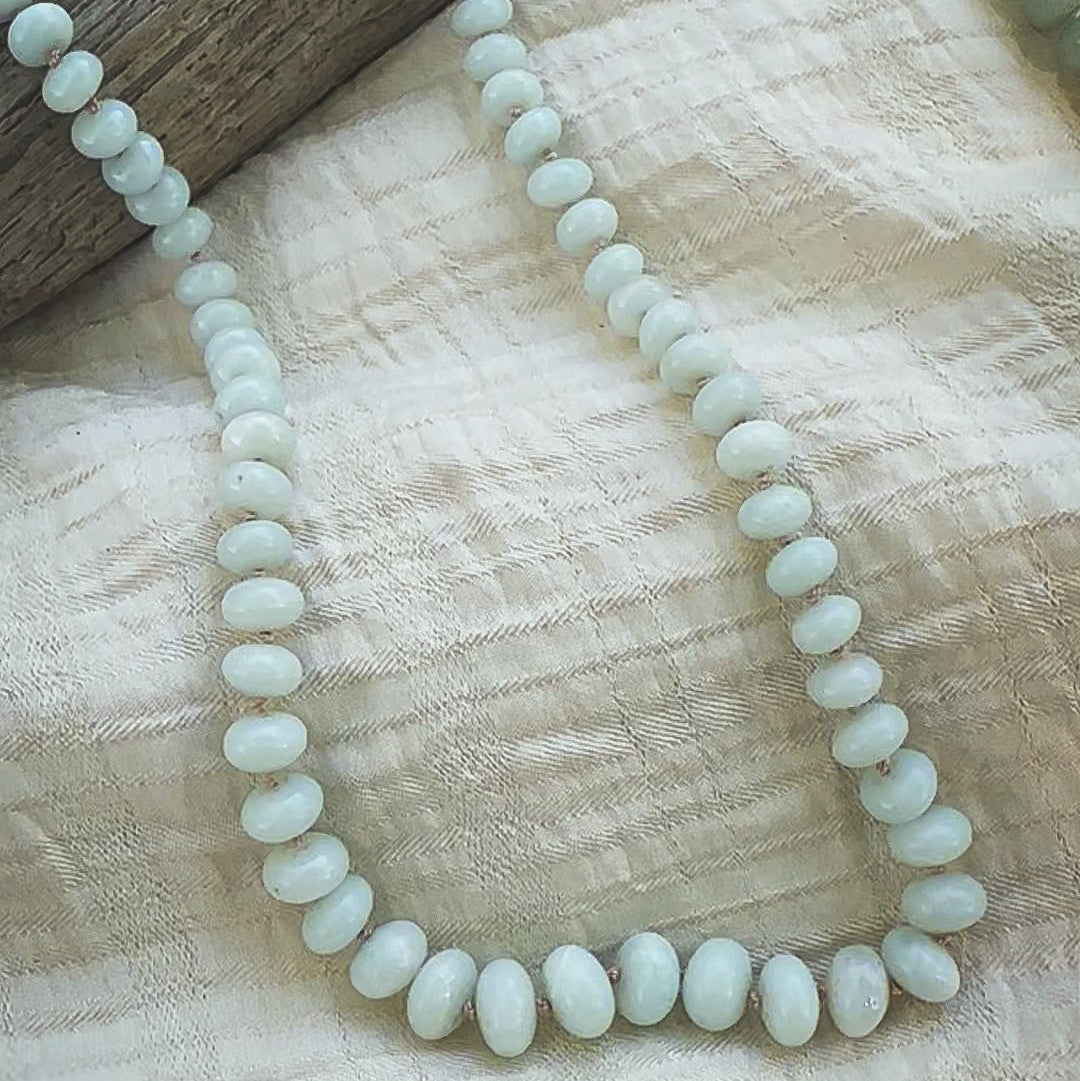 Pale green, graduated sized Amazonite beaded necklace, hand knotted on a beige sild thread. Natural Earth Collective Ohio