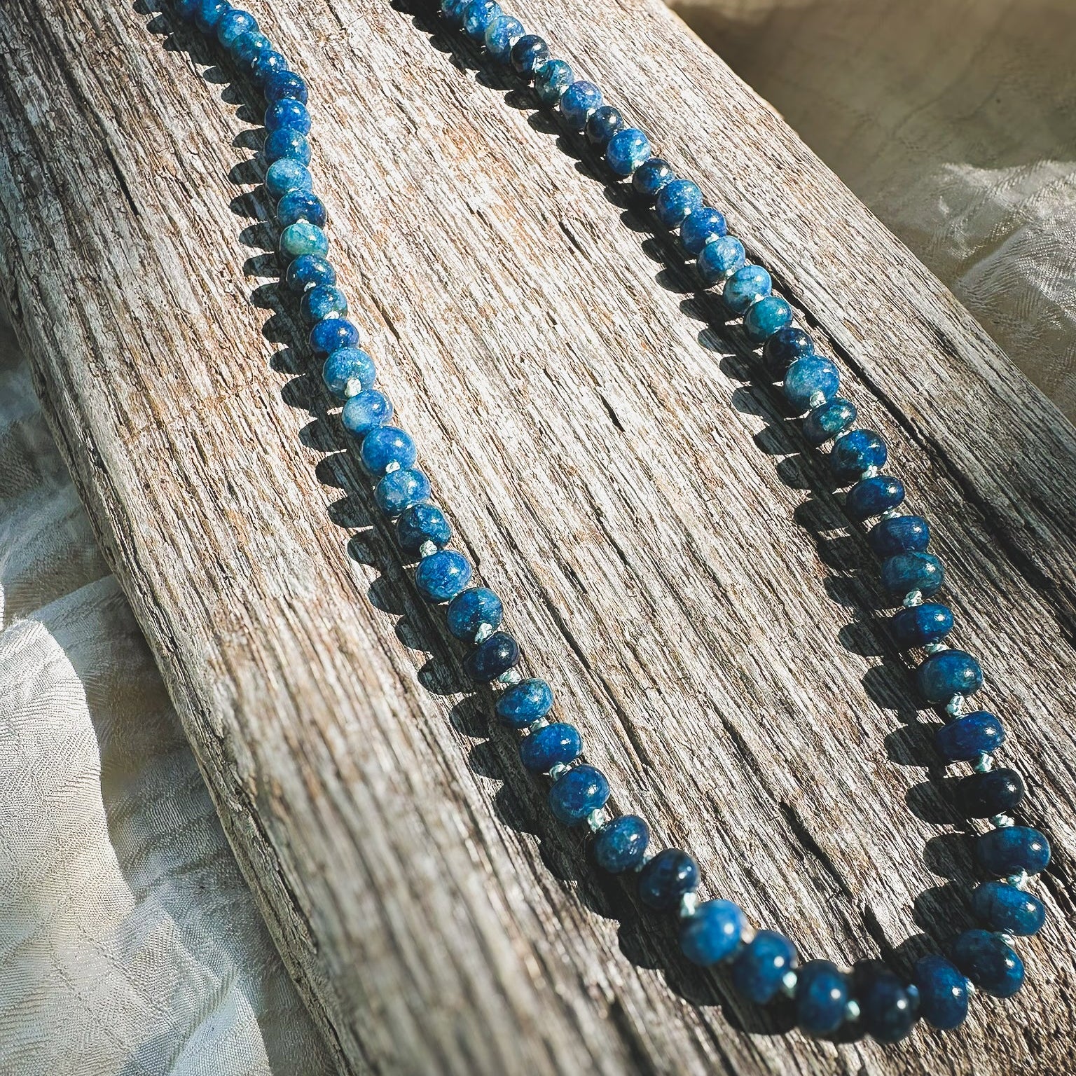 Blue Apatite Beaded necklace, hand knotted on light blue silk thread. Natuarl Earth Collective Ohio