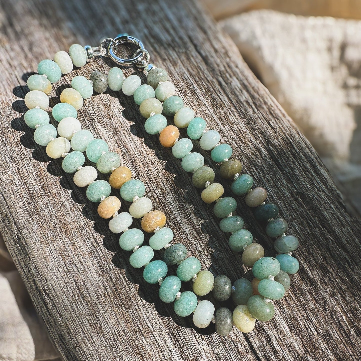Multi shade Amazonite Beaded Necklace, hand knotted on cream silk thread with a circle push clasp that can be worn in back or front to accommodate a pendant. Natural Earth Collective, Ohio