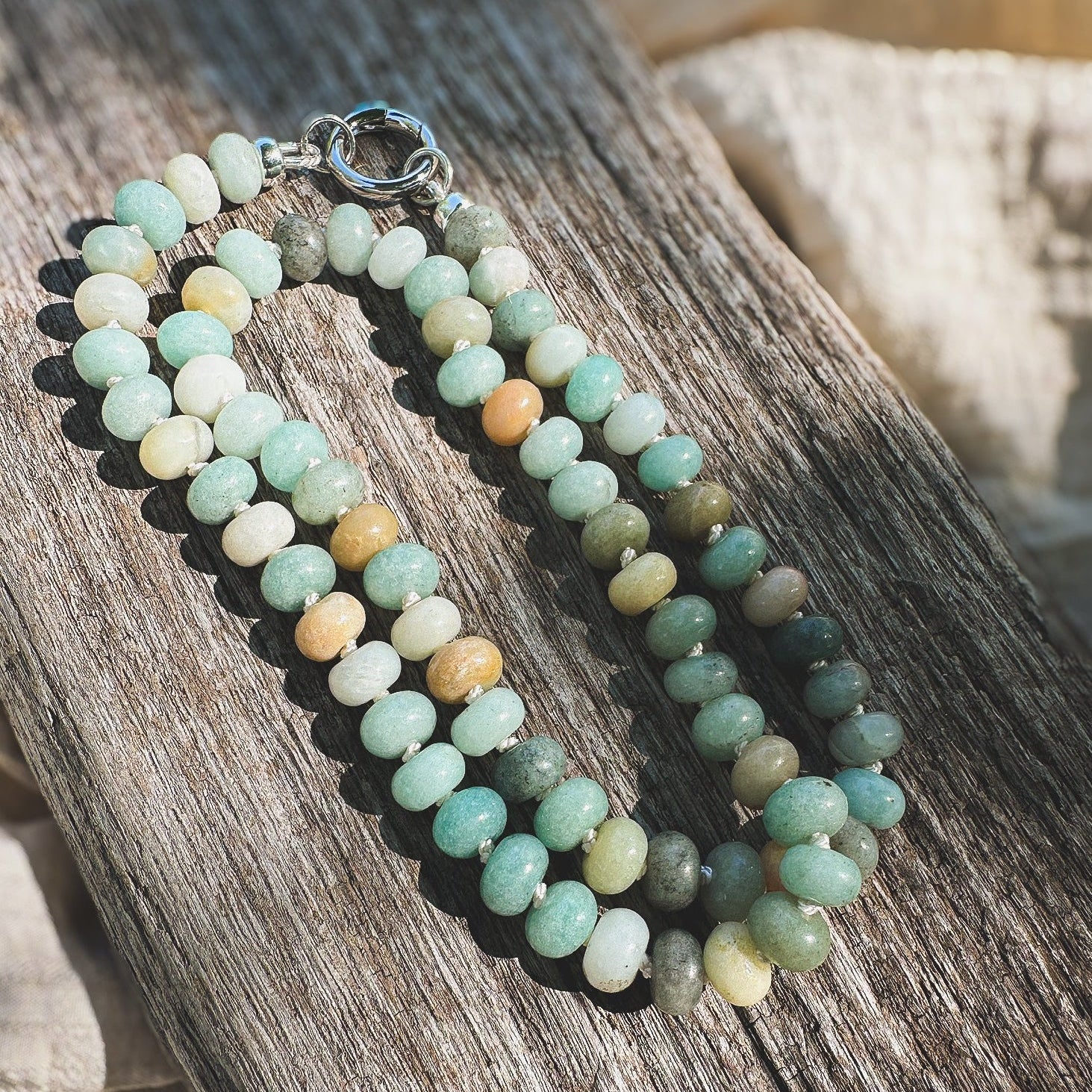 Multi shade Amazonite Beaded Necklace, hand knotted on cream silk thread with a circle push clasp that can be worn in back or front to accommodate a pendant. Natural Earth Collective, Ohio