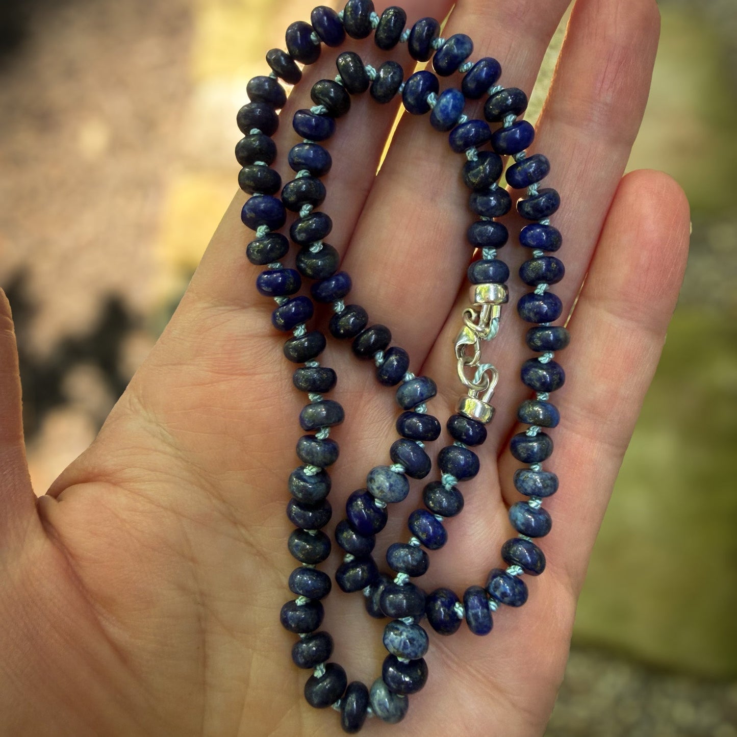 Lapis Azul rondelle beaded necklace hand knotted on pale blue sild thread. Natural Earth Collective Ohio
