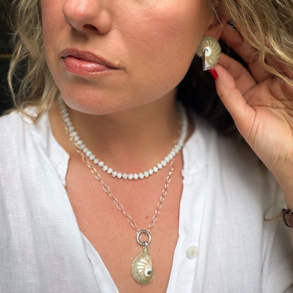 Mother of pearl beaded necklace hand knotted on light blue silk thread. Natural earth collective OH
