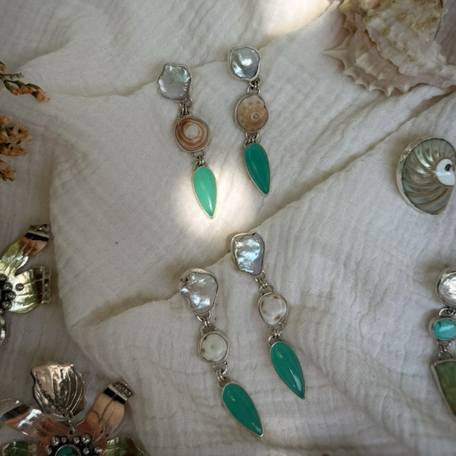 pearl puka shell and aqua chalcedony tiered dangle post earrings set in sterling silver. Natural Earth Collective Ohio