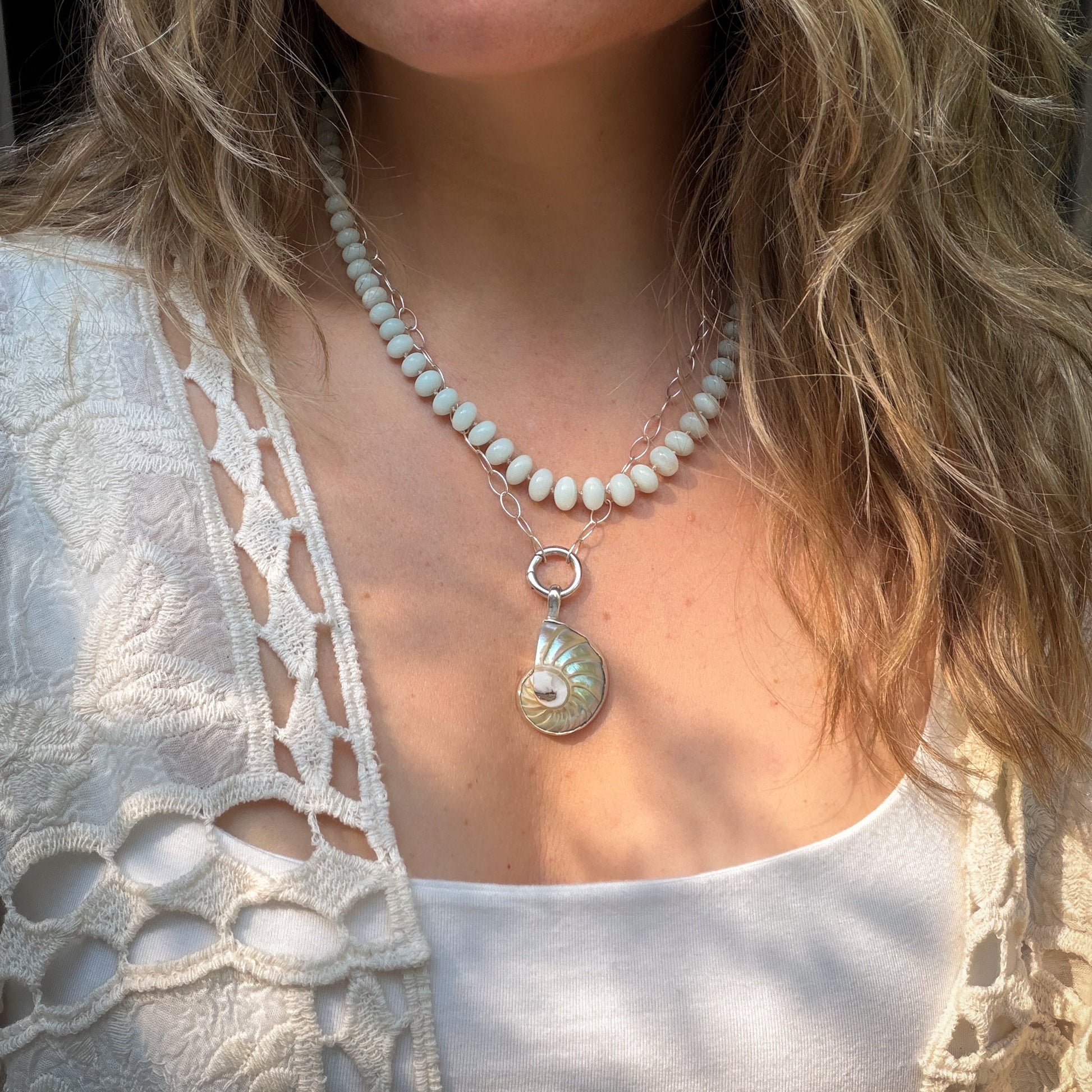 Nautilus shell pendant and stud earrings wrapped in sterling silver. Natural earth collective, Ohio