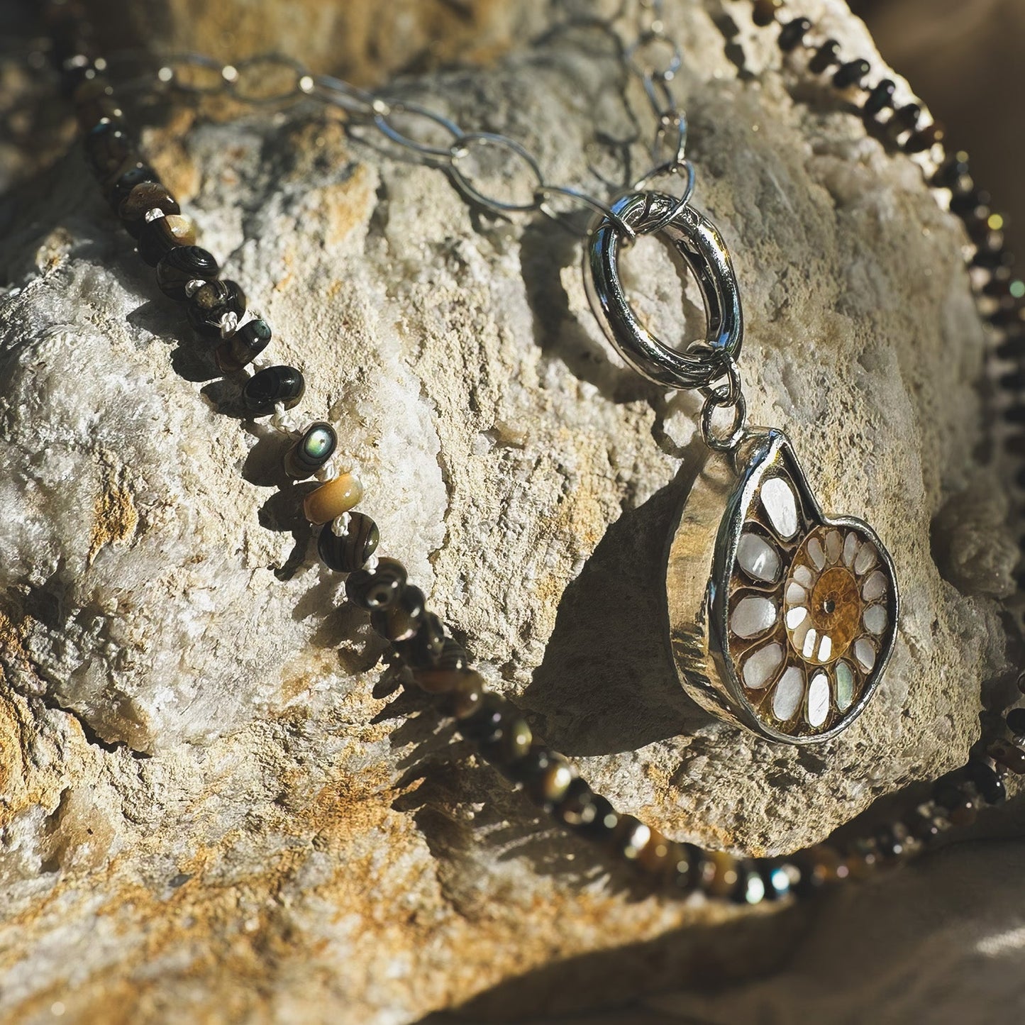 Ammonite fossil with inlaid mother of pearl pendandt set in sterling silver on a sterling silver chain with sterlin circle push clasp Natural Earth Collective Ohio