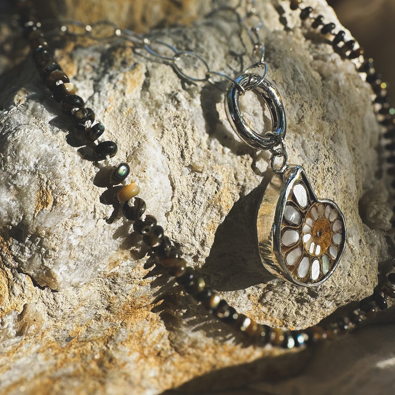 Ammonite fossil with inlaid mother of pearl pendandt set in sterling silver on a sterling silver chain with sterlin circle push clasp Natural Earth Collective Ohio