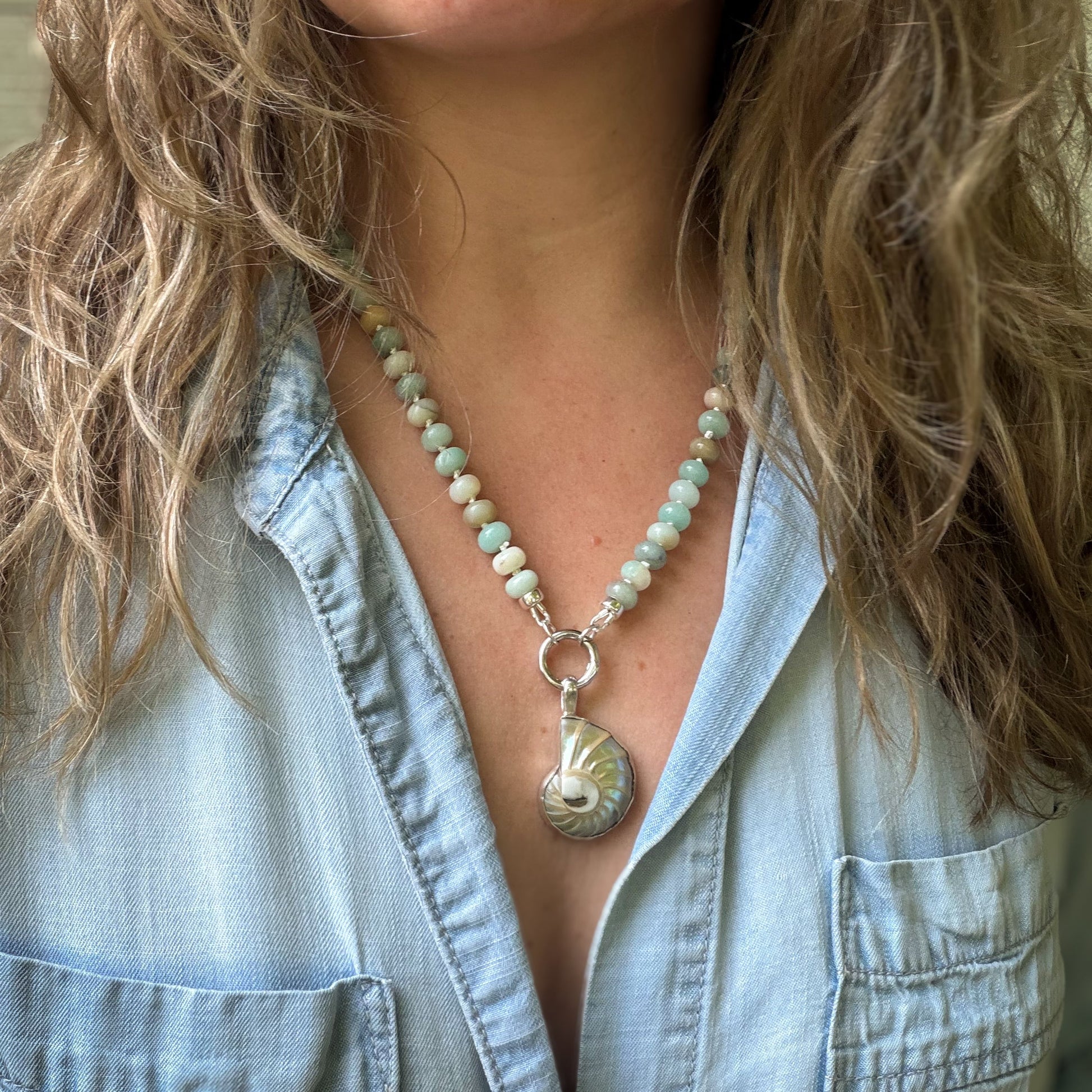 Nautilus shell pendant and stud earrings wrapped in sterling silver. Natural earth collective, Ohio