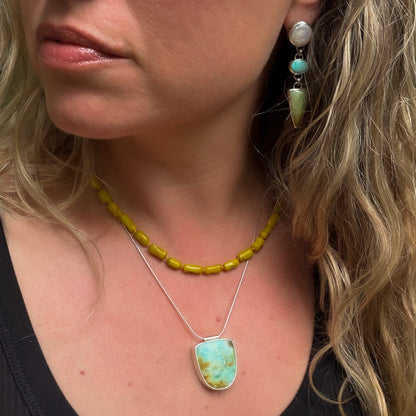 Opalized wood in shades of moss, yellow and aqua pendant  set in sterling silver on a sterling silver snake chain. Natural earth collective Ohio