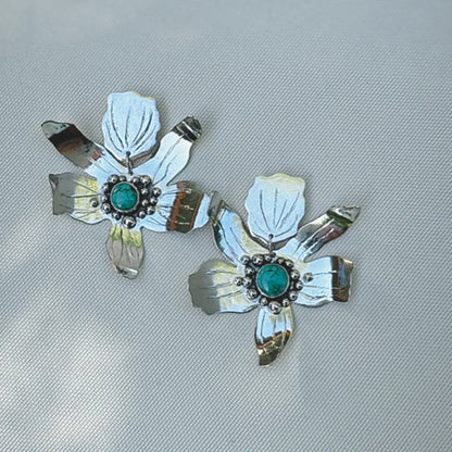 Hand fabricated sterling silver flower statement post earrings with #8 mine turquoise set in the centers. Natural Earth Collective Ohio 