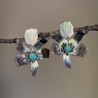 Hand fabricated sterling silver flower statement post earrings with #8 mine turquoise set in the centers. Natural Earth Collective Ohio 